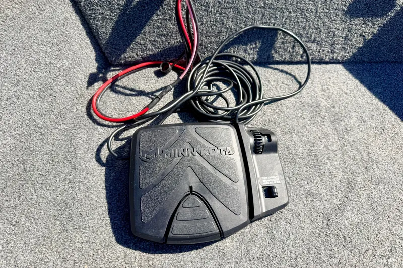 Slide: The Image of Minn Kota foot pedal on 2023 Ranger VS1665T boat carpet. - 60