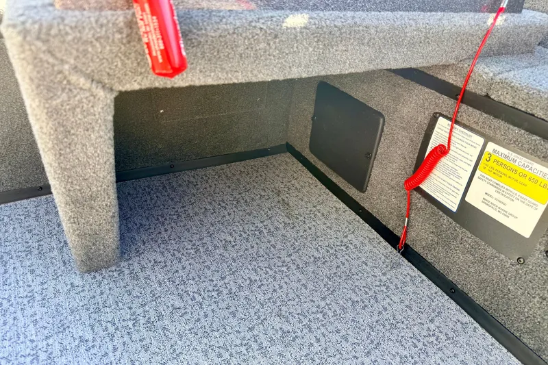 Slide: The Image of 2023 Ranger VS1665T boat interior with safety label and red cord. - 45