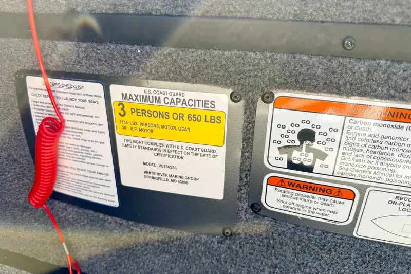 Slide: The Image of 2023 Ranger VS1665T boat capacity and safety warning labels. - 44