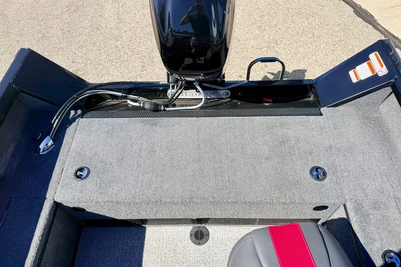Slide: The Image of 2023 Ranger VS1665T boat interior with motor and seating detail. - 23