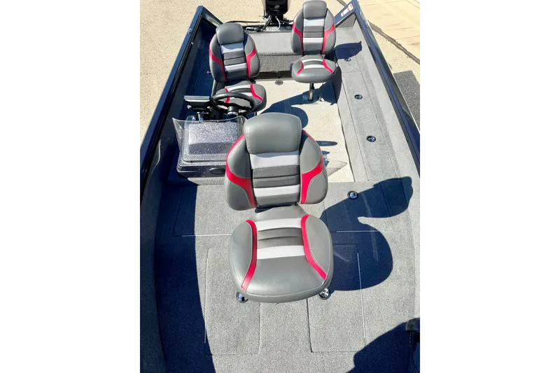 Slide: The Image of 2023 Ranger VS1665T boat interior with four gray and red seats. - 63