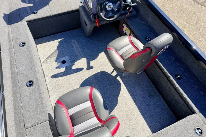 Slide: The Image of 2023 Ranger VS1665T boat interior with two seats and steering wheel. - 65
