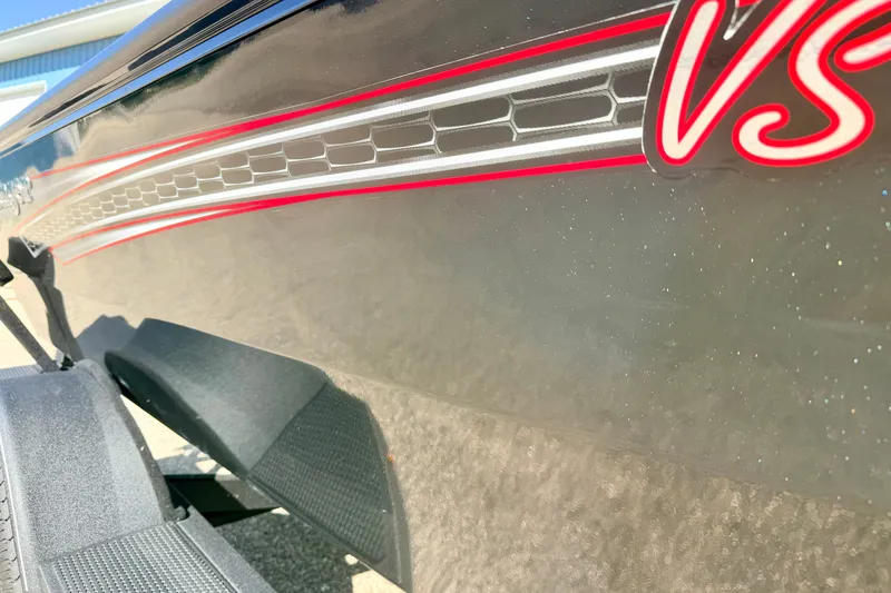 Slide: The Image of 2023 Ranger VS1665T boat with sleek design and red detailing. - 13