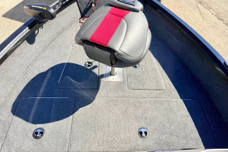 Slide: The Image of 2023 Ranger VS1665T boat interior with gray and red seating, carpeted flooring. - 46