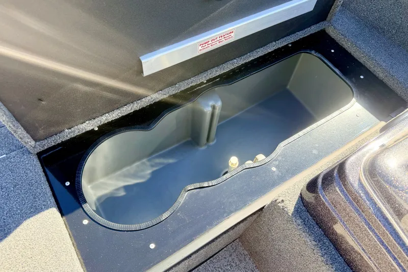 Slide: The Image of 2023 Ranger VS1665T boat storage compartment, open and empty, with textured interior. - 51