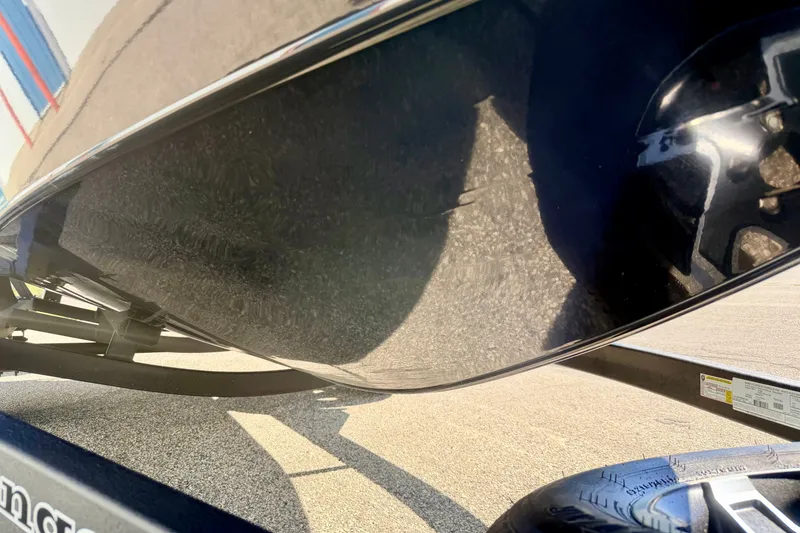 Slide: The Image of 2023 Ranger VS1665T boat hull and trailer detail in sunlight. - 76