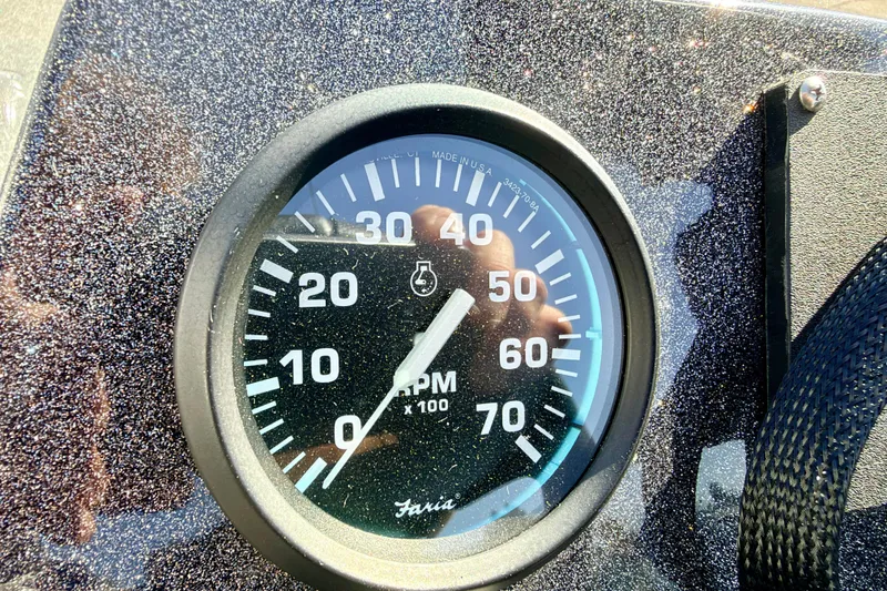 Slide: The Image of Tachometer on 2023 Ranger VS1665T boat dashboard, showing RPM gauge. - 39