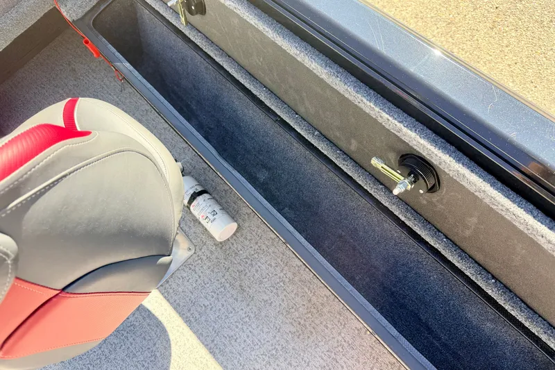 Slide: The Image of Interior of 2023 Ranger VS1665T boat showing seat and storage compartment. - 27