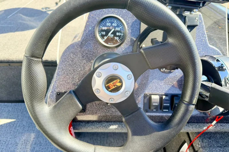 Slide: The Image of Steering wheel of 2023 Ranger VS1665T boat with dashboard controls and speedometer. - 38