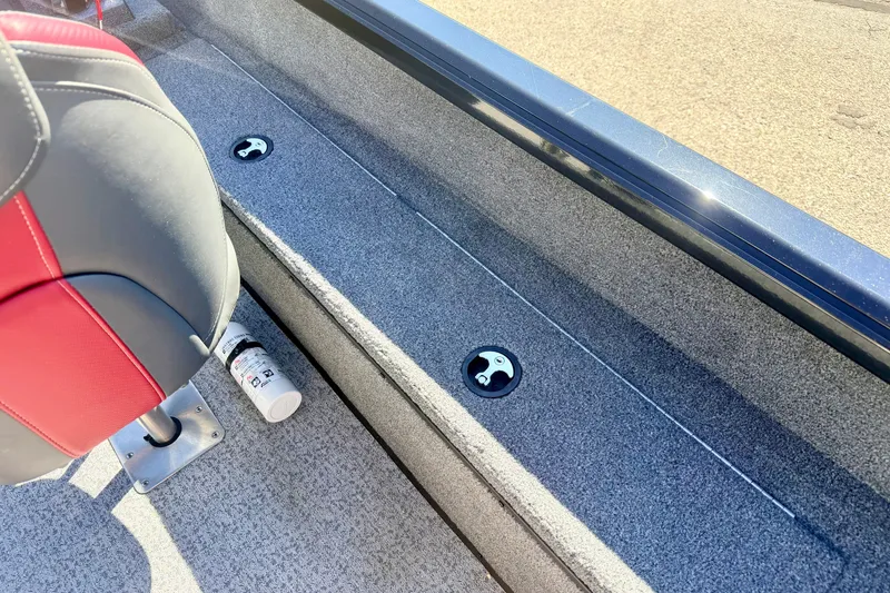 Slide: The Image of Interior of 2023 Ranger VS1665T boat with red and gray seating. - 26