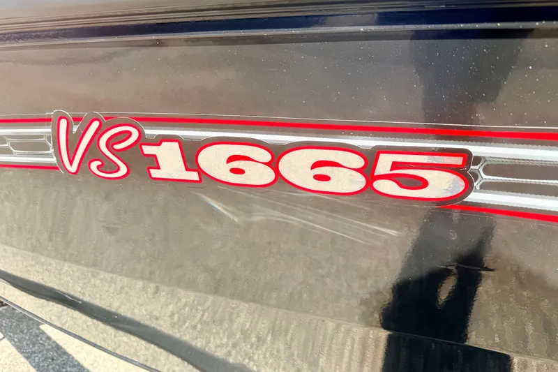 Slide: The Image of Close-up of 2023 Ranger VS1665T model logo on a dark surface. - 9
