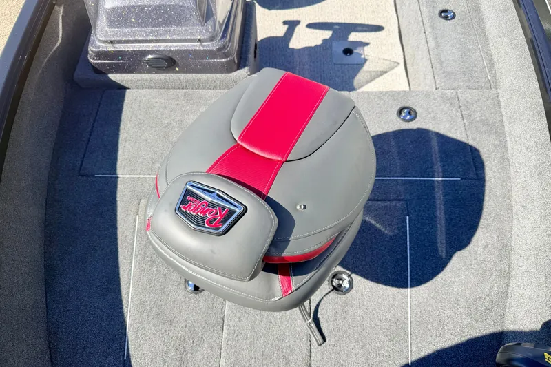 Slide: The Image of 2023 Ranger VS1665T boat seat with red and gray upholstery on carpeted deck. - 53