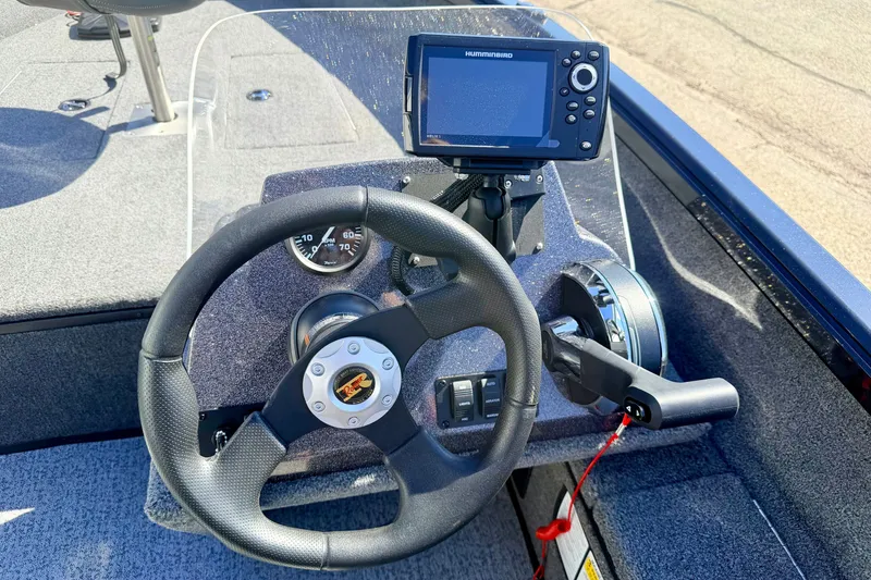 Slide: The Image of 2023 Ranger VS1665T boat dashboard with steering wheel and navigation system. - 37