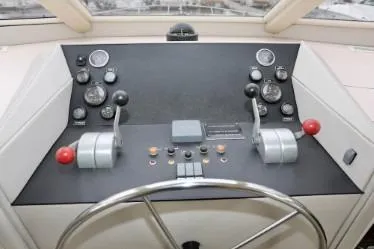 Slide: The Image of Control panel of a 1989 custom boat with steering wheel and gauges. - 21