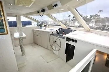 Slide: The Image of Luxurious 1989 custom yacht interior with modern helm, panoramic windows, and sleek design. - 22