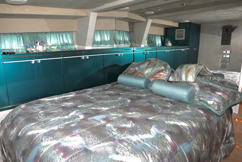 Slide: The Image of Luxurious custom bedroom interior with teal accents and patterned bedding, 1989 design. - 30