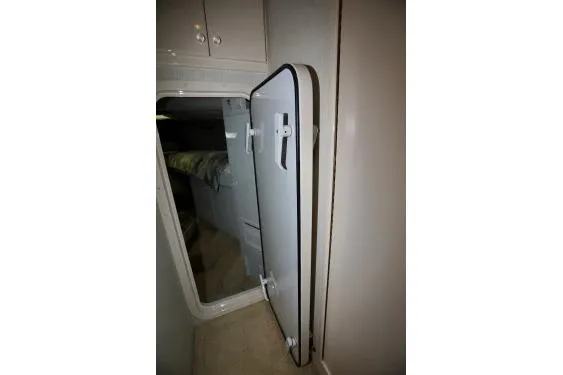 Slide: The Image of Hatch door in a custom 1989 vehicle interior, partially open, revealing a cabin space. - 31