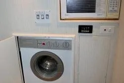 Slide: The Image of Compact laundry area with a washing machine and microwave, custom design, 1989. - 34