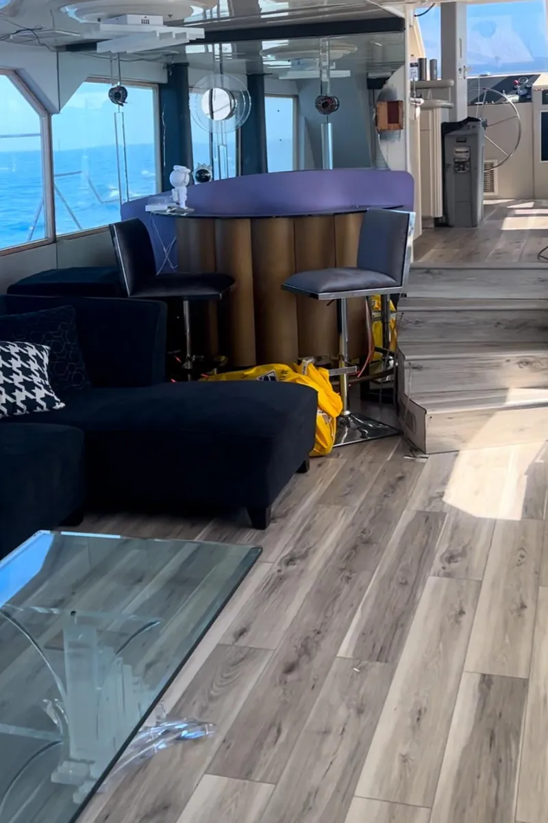 Slide: The Image of Luxurious yacht interior with modern bar, seating, and ocean view, 1989 custom model. - 19