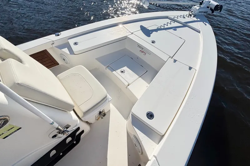 Slide: The Image of 2016 Pathfinder 2300 HPS boat interior with seating and storage, on water. - 15