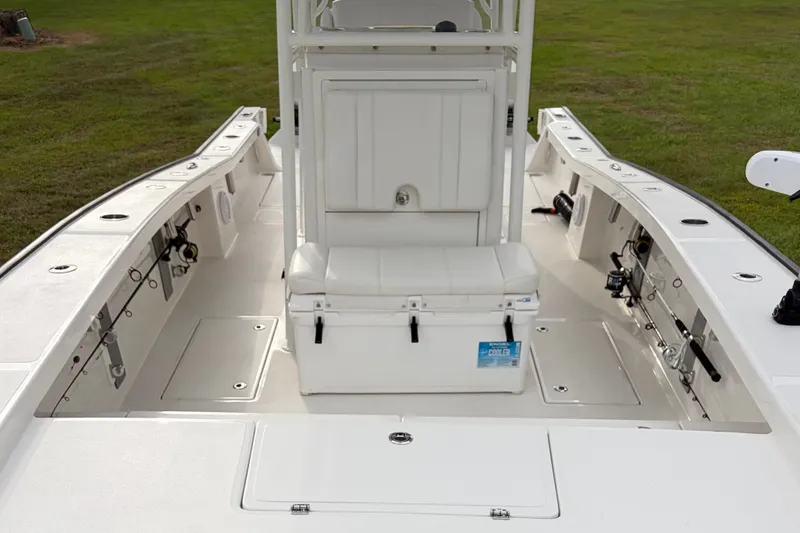 Slide: The Image of 2025 Calcutta 263 boat interior with seating and fishing rod holders on deck. - 10