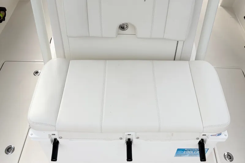 Slide: The Image of White cushioned seat on Calcutta 263 boat, 2025 model, featuring integrated cooler. - 12