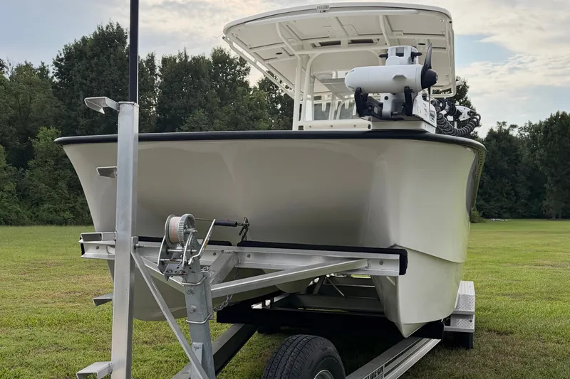 Slide: The Image of Calcutta 263 boat on trailer, grassy field, 2025 model. - 4