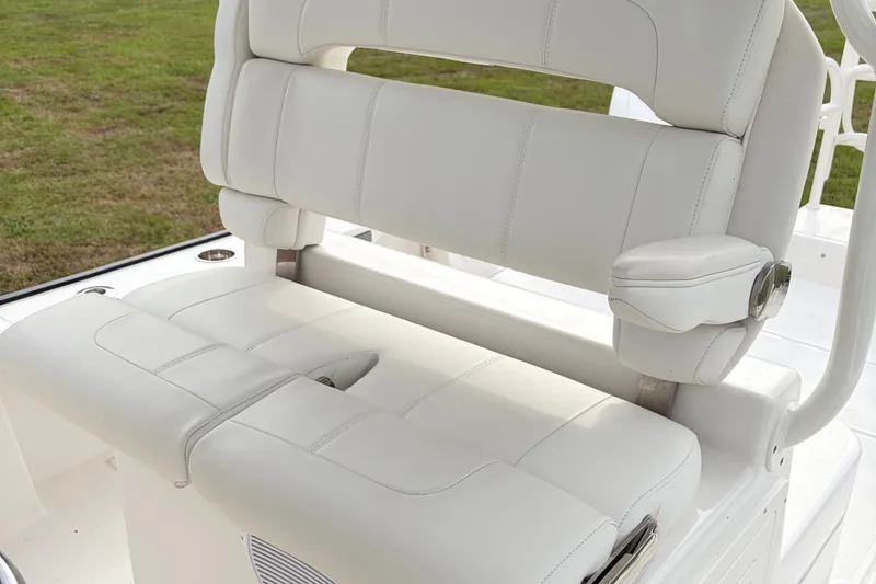 Slide: The Image of White leather boat seat on Calcutta 263, 2025 model, with armrest and cup holder. - 11
