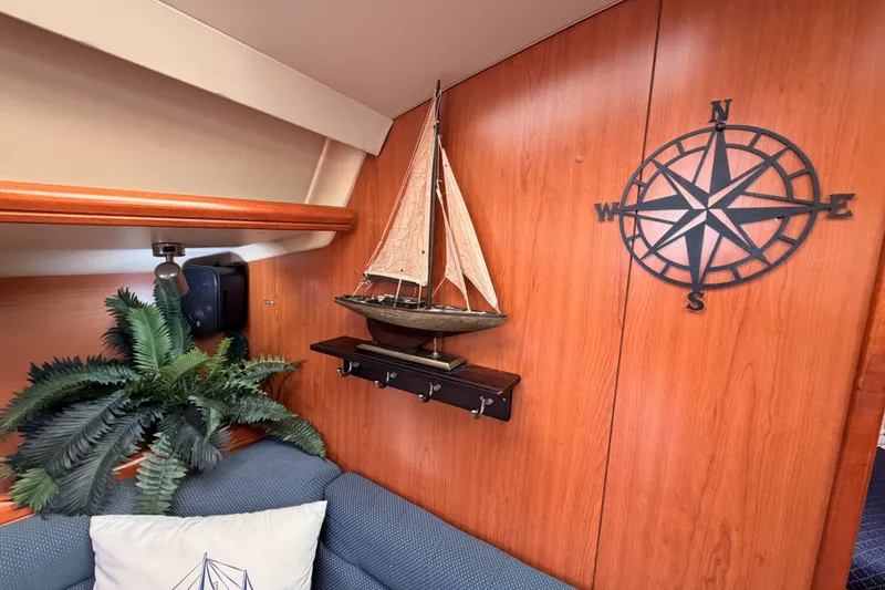 Slide: The Image of Interior of 2009 Hunter 33 sailboat with nautical decor and compass wall art. - 53