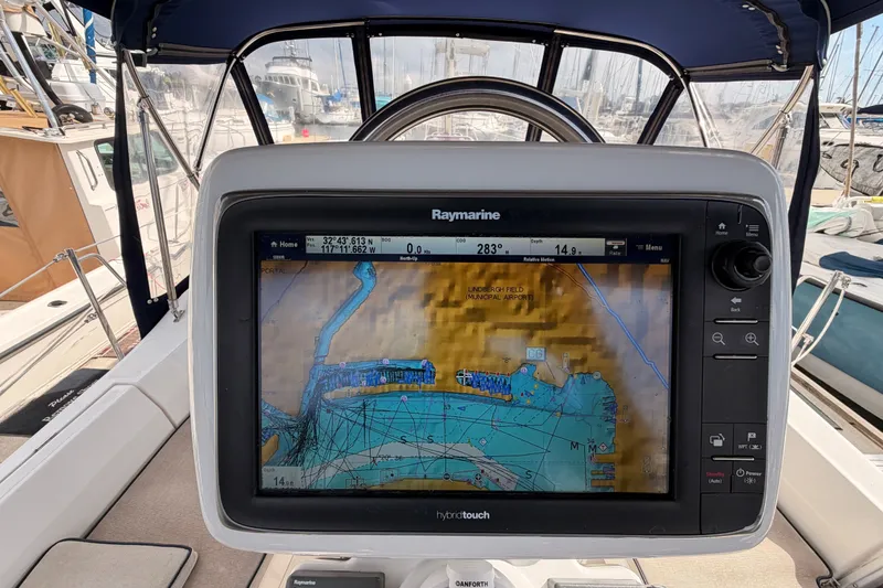 Slide: The Image of Cockpit of 2009 Hunter 33 sailboat with Raymarine navigation display. - 31