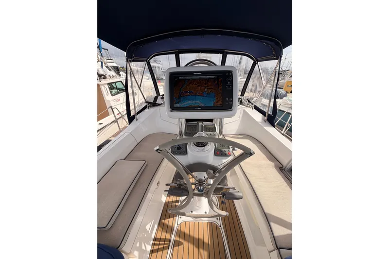 Slide: The Image of Cockpit of 2009 Hunter 33 sailboat with navigation system and steering wheel. - 29