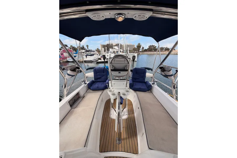 Slide: The Image of Cockpit of 2009 Hunter 33 sailboat with blue seating, docked at marina. - 22