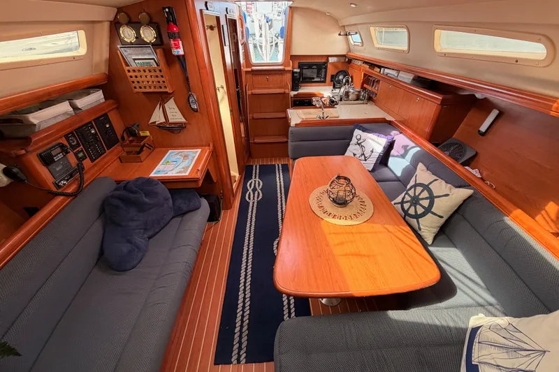 Slide: The Image of Interior of a 2009 Hunter 33 sailboat with cozy seating and nautical decor. - 60
