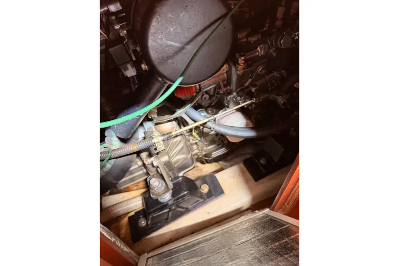 Slide: The Image of Engine compartment of a 2009 Hunter 33 sailboat, showing mechanical components and wiring. - 66