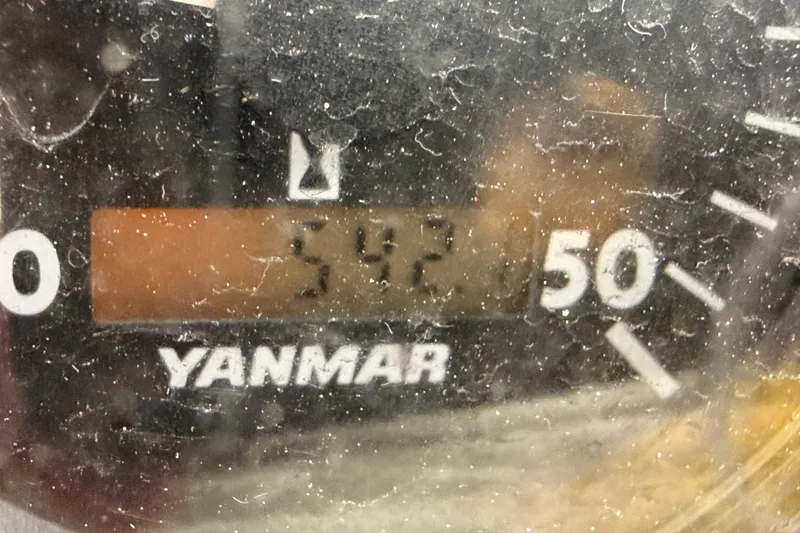 Slide: The Image of Yanmar engine gauge displaying 542 hours on a 2009 Hunter 33 sailboat. - 63
