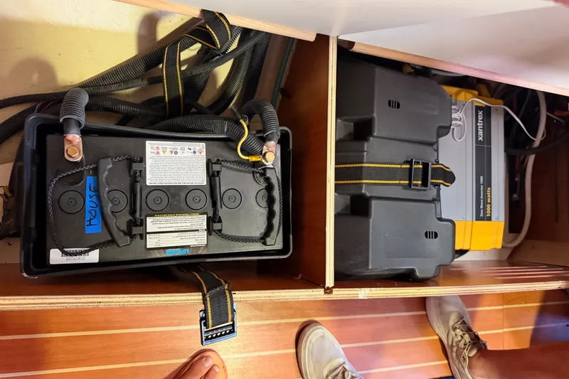Slide: The Image of Battery compartment of a 2009 Hunter 33 sailboat with wiring and inverter. - 67