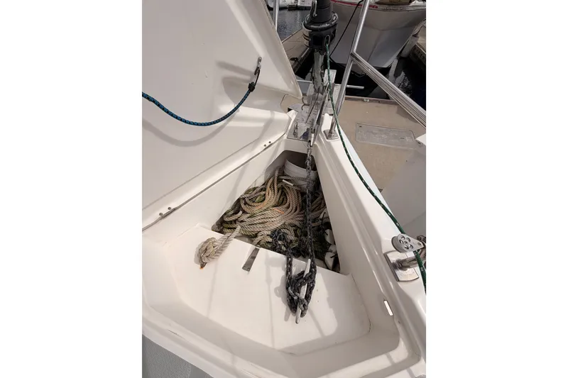 Slide: The Image of Anchor locker of a 2009 Hunter 33 sailboat with ropes and chains. - 15