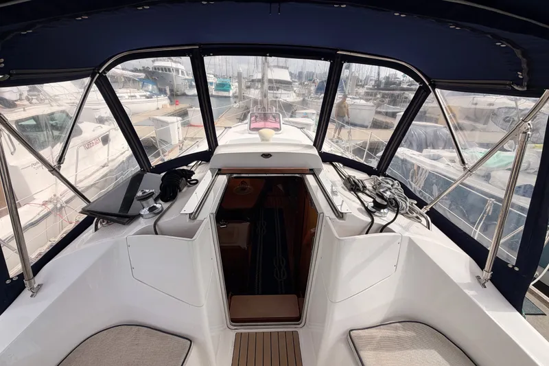 Slide: The Image of Cockpit view of a 2009 Hunter 33 sailboat docked at a marina. - 32