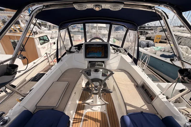 Slide: The Image of Cockpit of 2009 Hunter 33 sailboat with navigation equipment and seating. - 28