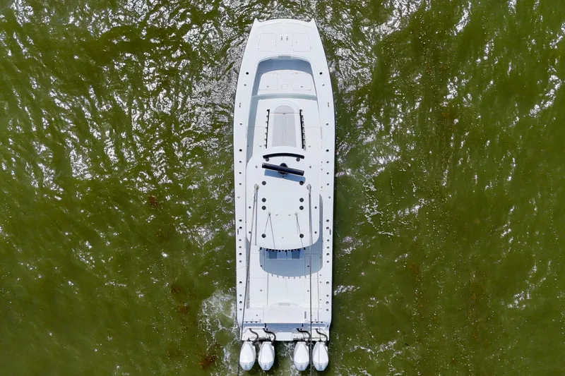 Slide: The Image of Overhead view of 2024 Freeman 38 boat on green water. - 11