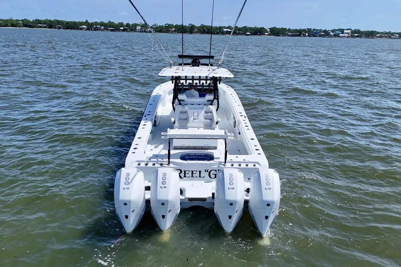 Slide: The Image of 2024 Freeman 38 boat with quad 300 V8 engines on open water. - 4