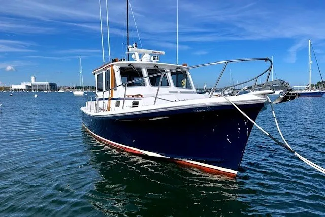 The Image of 2007 Eastern 31 Casco Bay boat anchored in a sunny harbor. - 0