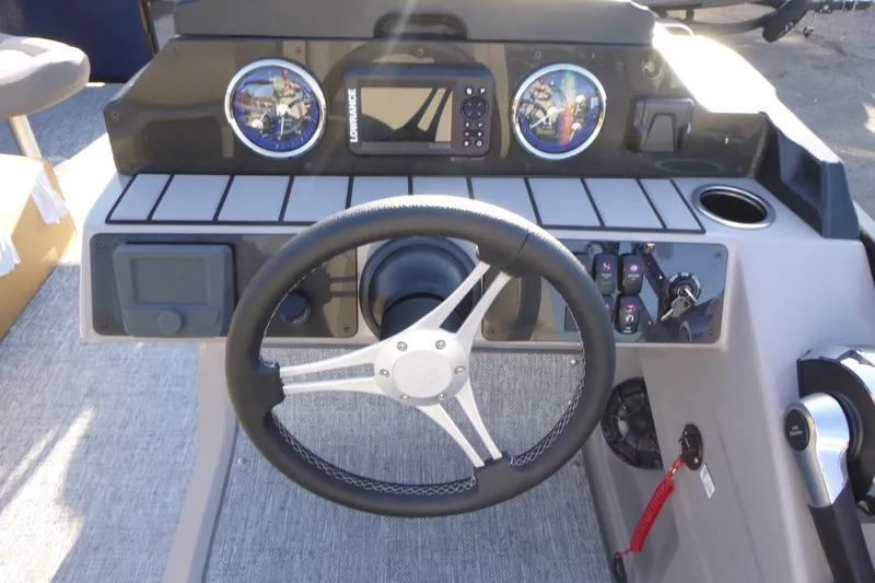 Slide: The Image of Steering console of 2027 Premier 210 Sunsation Angler 4PT - CL with gauges and controls. - 17