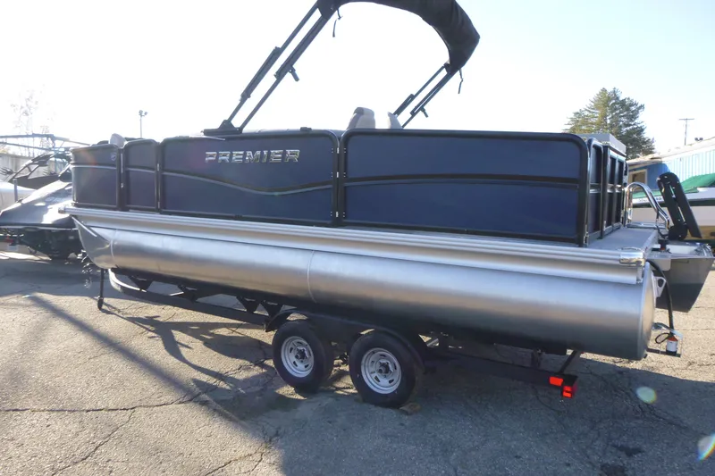 Slide: The Image of 2027 Premier 210 Sunsation Angler 4PT pontoon boat on trailer, side view. - 7