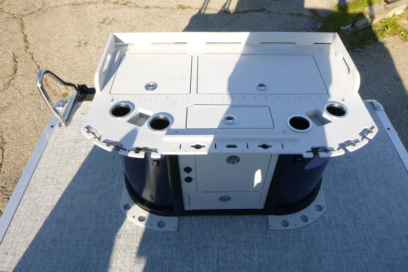 Slide: The Image of 2027 Premier 210 Sunsation Angler 4PT-CL boat console with cup holders and storage compartments. - 25