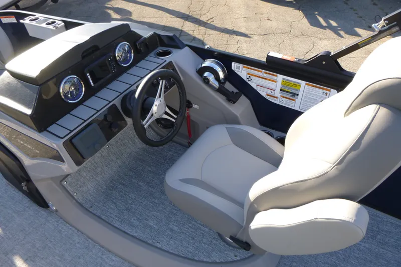 Slide: The Image of Interior view of 2027 Premier 210 Sunsation Angler 4PT - CL boat dashboard and seating. - 16
