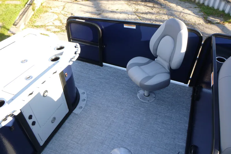 Slide: The Image of 2027 Premier 210 Sunsation Angler 4PT - CL boat interior with seating and storage. - 20