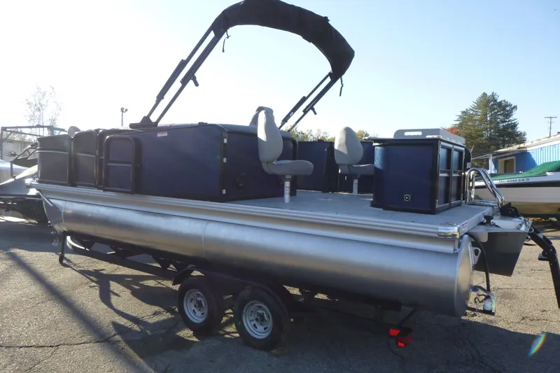 Slide: The Image of 2027 Premier 210 Sunsation Angler 4PT-CL pontoon boat on trailer, side view. - 8