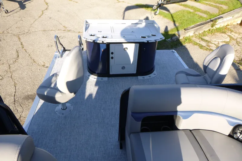 Slide: The Image of 2027 Premier 210 Sunsation Angler 4PT - CL boat interior with seating and console. - 22