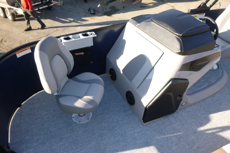 Slide: The Image of 2027 Premier 210 Sunsation Angler 4PT - CL boat interior with seating and console. - 13